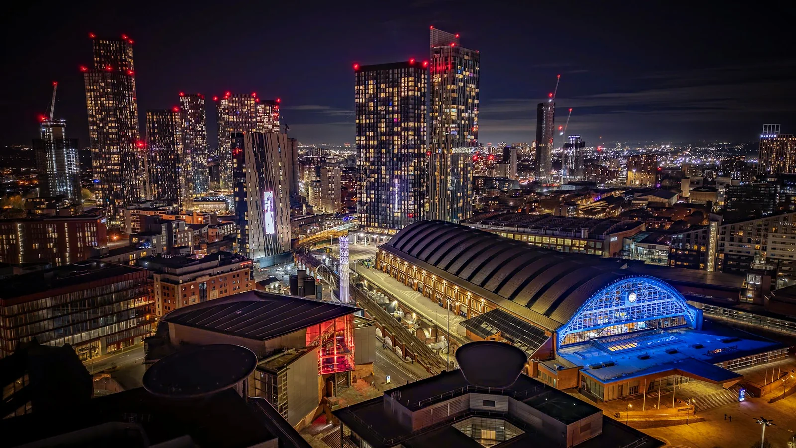 Manchester transport and skyline at night